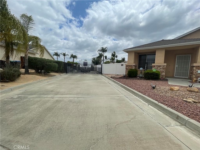 24967 Volga St, Hemet, CA 92544 - view of street with a gate and curbs