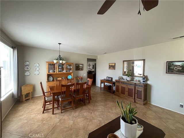 24967 Volga St, Hemet, CA 92544 - dining space with a ceiling fan, light tile patterned floors, and a chandelier