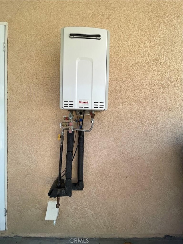 24967 Volga St, Hemet, CA 92544 - detailed view of tankless water heater and stucco siding