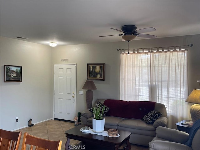 24967 Volga St, Hemet, CA 92544 - living room featuring a ceiling fan, light tile patterned floors, and baseboards