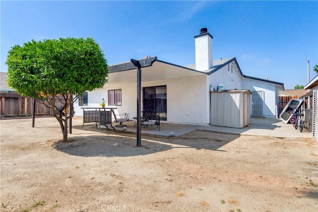 813 Yorkshire, San Jacinto, CA 92583 - rear view of property with a patio and a chimney