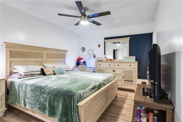 813 Yorkshire, San Jacinto, CA 92583 - bedroom featuring a textured ceiling, wood finished floors, and ceiling fan