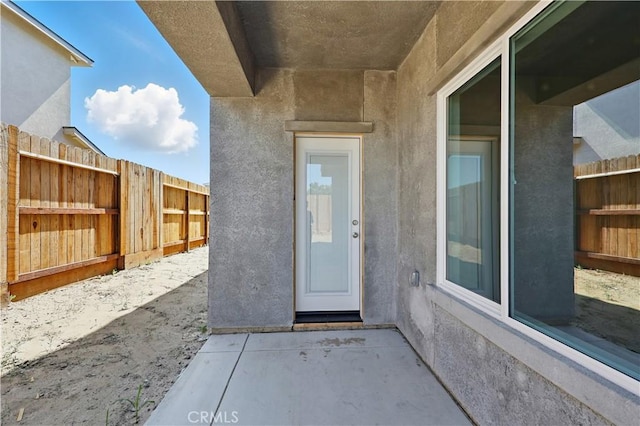 428 Oleander Ct, Chowchilla, CA 93610 - property entrance with stucco siding and a patio