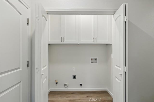 428 Oleander Ct, Chowchilla, CA 93610 - laundry area featuring gas dryer hookup, electric dryer hookup, cabinet space, wood finished floors, and washer hookup