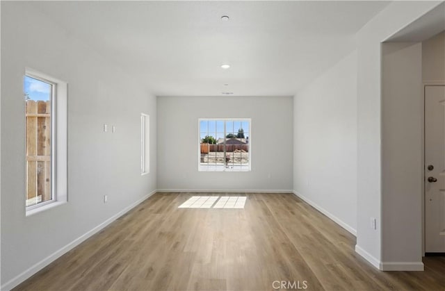 428 Oleander Ct, Chowchilla, CA 93610 - spare room featuring wood finished floors and baseboards