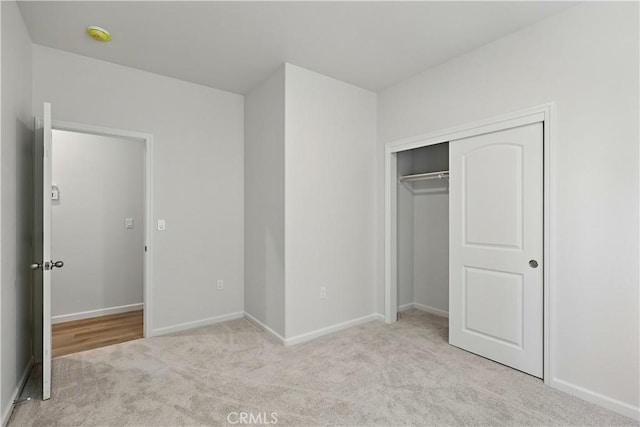 428 Oleander Ct, Chowchilla, CA 93610 - unfurnished bedroom with light carpet, a closet, and baseboards