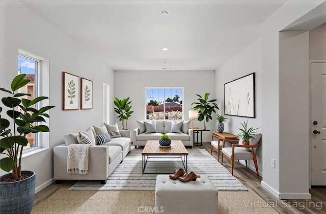428 Oleander Ct, Chowchilla, CA 93610 - living area featuring wood finished floors, baseboards, and recessed lighting