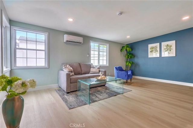 2124 Baltic Ave, Long Beach, CA 90810 - living room featuring a wall unit AC, wood finished floors, baseboards, and recessed lighting