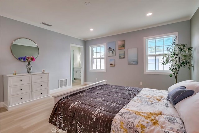 2124 Baltic Ave, Long Beach, CA 90810 - bedroom with light wood-type flooring, crown molding, recessed lighting, and baseboards