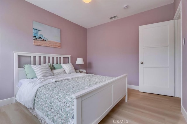 2124 Baltic Ave, Long Beach, CA 90810 - bedroom with light wood-type flooring and baseboards