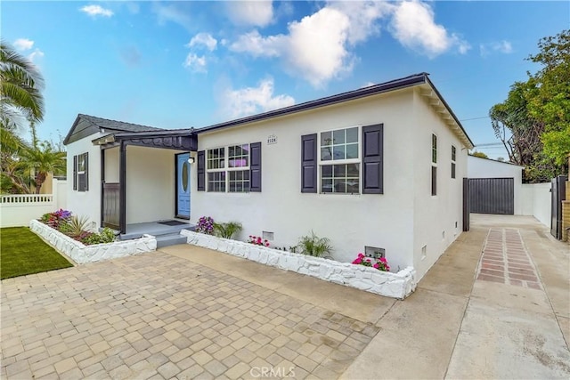 2124 Baltic Ave, Long Beach, CA 90810 - view of front of house with stucco siding, crawl space, and a patio area