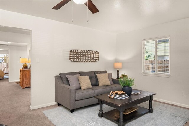 1170 Hobart St, Chico, CA 95926 - living room featuring ceiling fan, baseboards, and light carpet