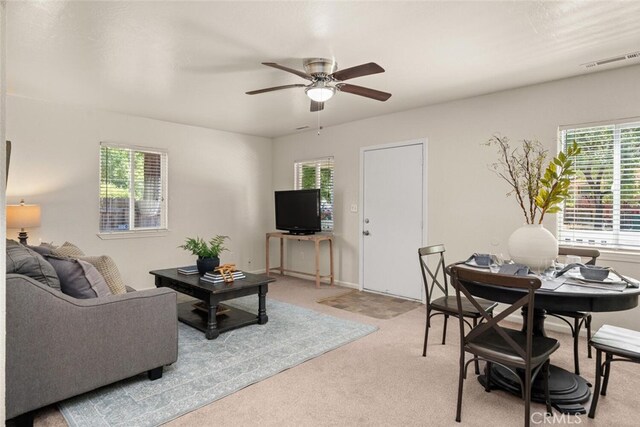 1170 Hobart St, Chico, CA 95926 - living area featuring light colored carpet, plenty of natural light, and a ceiling fan