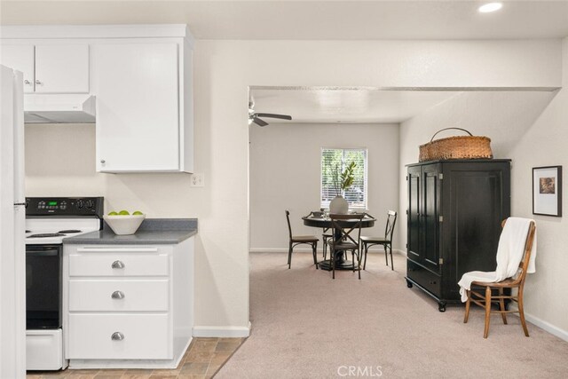 1170 Hobart St, Chico, CA 95926 - kitchen featuring range with electric cooktop, exhaust hood, white cabinetry, light carpet, and recessed lighting