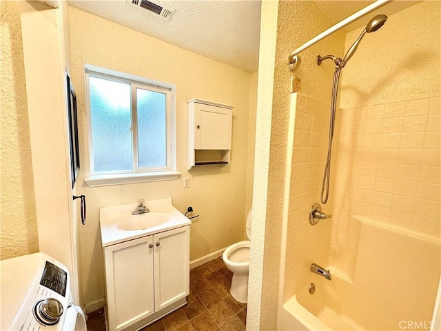 1170 Hobart St, Chico, CA 95926 - bathroom featuring toilet, shower / tub combination, vanity, a textured wall, and a textured ceiling