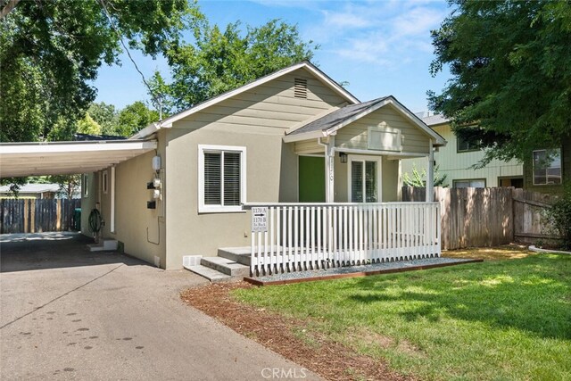 1170 Hobart St, Chico, CA 95926 - view of front facade with asphalt driveway, a porch, stucco siding, and an attached carport