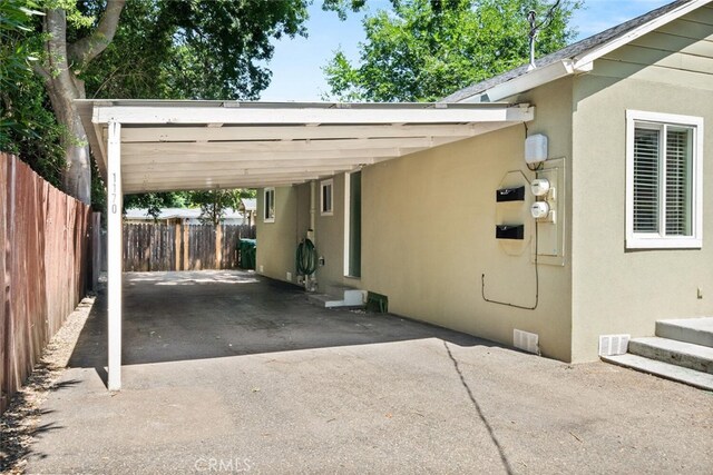1170 Hobart St, Chico, CA 95926 - view of car parking with an attached carport and asphalt driveway