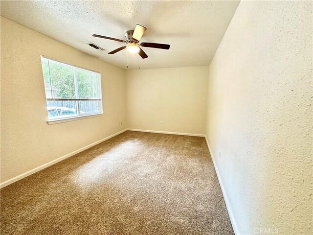 1170 Hobart St, Chico, CA 95926 - unfurnished room with a ceiling fan, baseboards, carpet floors, a textured wall, and a textured ceiling