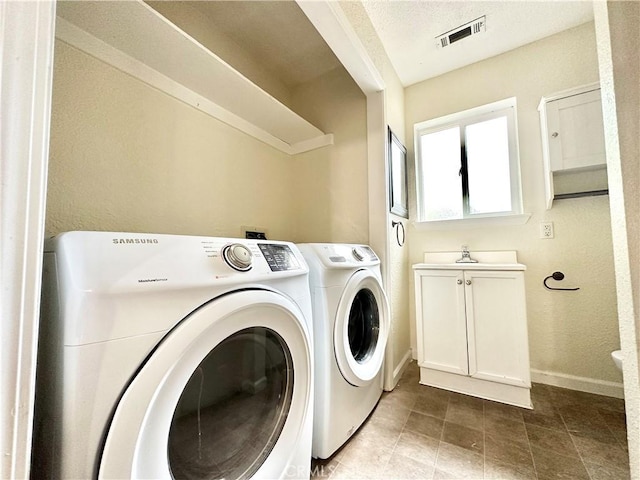 1170 Hobart St, Chico, CA 95926 - laundry room featuring independent washer and dryer, baseboards, and cabinet space