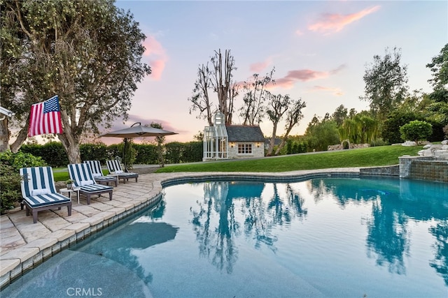 10 Strawberry Ln, San Juan Capistrano, CA 92675 - outdoor pool featuring an outbuilding, a patio area, a yard, and an exterior structure