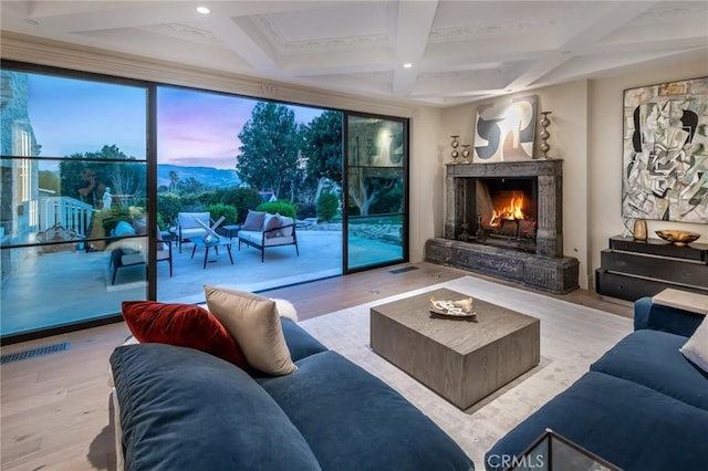 10 Strawberry Ln, San Juan Capistrano, CA 92675 - living area featuring wood finished floors, a lit fireplace, coffered ceiling, beamed ceiling, and recessed lighting