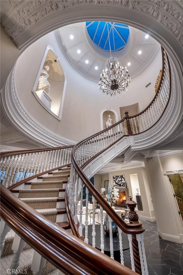 10 Strawberry Ln, San Juan Capistrano, CA 92675 - staircase featuring a high ceiling, recessed lighting, ornamental molding, baseboards, and a chandelier