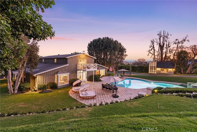 10 Strawberry Ln, San Juan Capistrano, CA 92675 - outdoor pool featuring a patio, a yard, and an outdoor structure