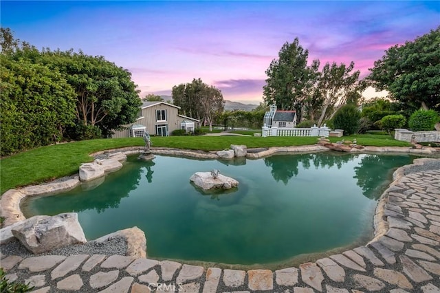 10 Strawberry Ln, San Juan Capistrano, CA 92675 - outdoor pool with a lawn and a garden pond