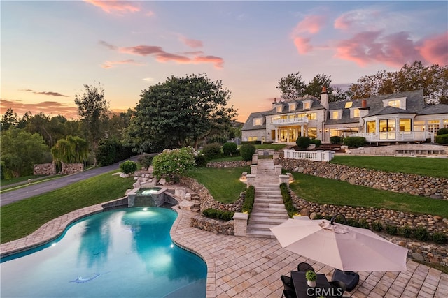 10 Strawberry Ln, San Juan Capistrano, CA 92675 - view of pool with a lawn, a patio area, and a pool with connected hot tub