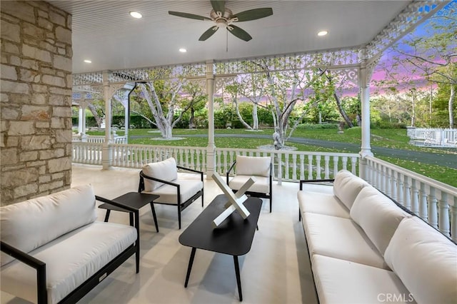 10 Strawberry Ln, San Juan Capistrano, CA 92675 - patio terrace at dusk featuring outdoor lounge area, a ceiling fan, and a lawn