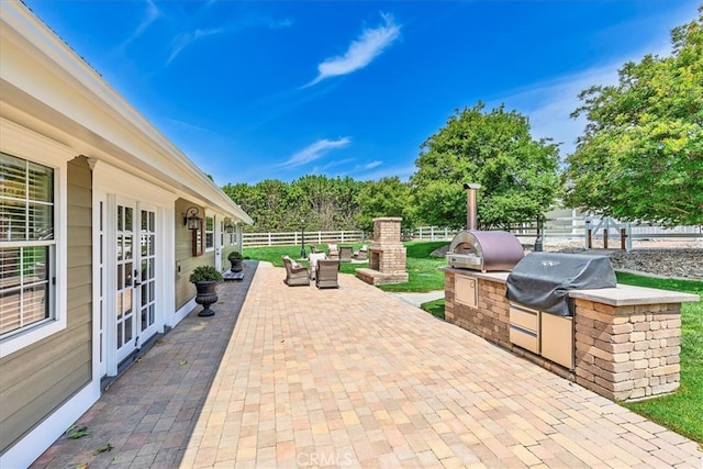 30026 Santiago Rd, Temecula, CA 92592 - view of patio / terrace with an outdoor kitchen and french doors