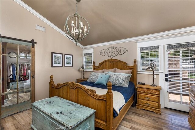 30026 Santiago Rd, Temecula, CA 92592 - bedroom featuring ornamental molding, a chandelier, wood finished floors, lofted ceiling, and a closet