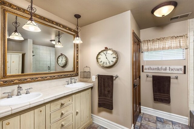 30026 Santiago Rd, Temecula, CA 92592 - full bath with baseboards, double vanity, and tiled shower