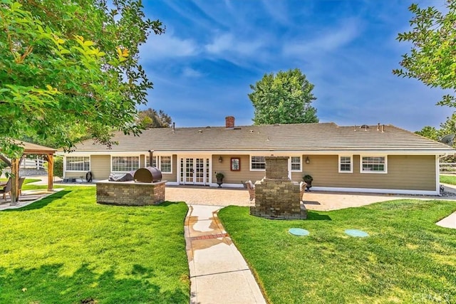 30026 Santiago Rd, Temecula, CA 92592 - back of house with a patio, exterior kitchen, a lawn, and a chimney