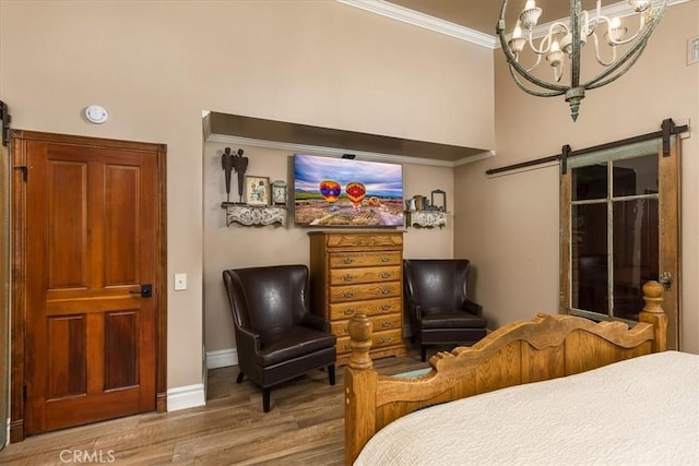 30026 Santiago Rd, Temecula, CA 92592 - bedroom featuring wood finished floors, ornamental molding, a chandelier, and a barn door
