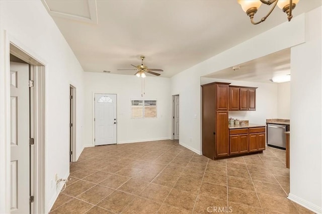 30026 Santiago Rd, Temecula, CA 92592 - kitchen with stainless steel dishwasher, light tile patterned flooring, brown cabinetry, ceiling fan, and light countertops