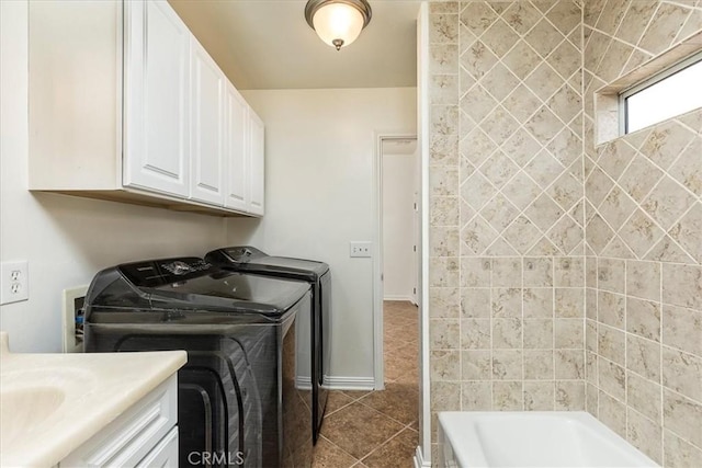 30026 Santiago Rd, Temecula, CA 92592 - laundry area featuring washing machine and clothes dryer and dark tile patterned floors