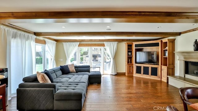 21822 Seacrest Ln, Huntington Beach, CA 92646 - living room featuring beamed ceiling, wood-type flooring, a fireplace with raised hearth, and ornamental molding