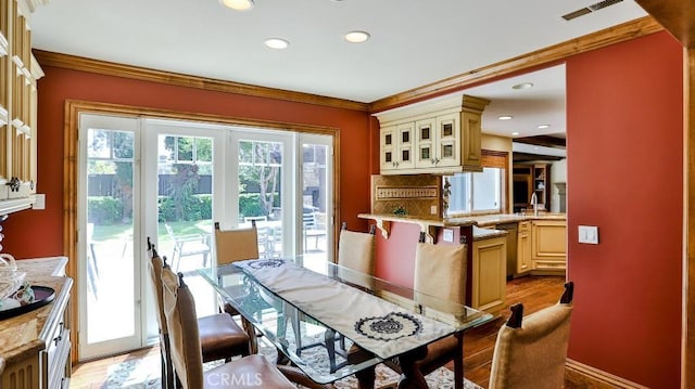 21822 Seacrest Ln, Huntington Beach, CA 92646 - dining room with crown molding, light wood-style floors, and recessed lighting