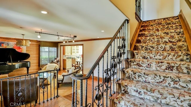 21822 Seacrest Ln, Huntington Beach, CA 92646 - stairway featuring wood finished floors, ornamental molding, and recessed lighting