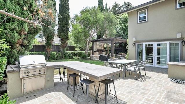 21822 Seacrest Ln, Huntington Beach, CA 92646 - view of patio with french doors, a pergola, and an outdoor fireplace