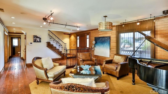 21822 Seacrest Ln, Huntington Beach, CA 92646 - living area featuring track lighting, stairway, hardwood / wood-style floors, and baseboards