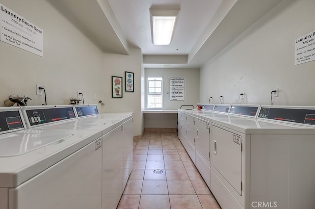 3120 Sepulveda Blvd Unit 312, Torrance, CA 90505 - communal laundry room with separate washer and dryer, light tile patterned floors, and baseboards