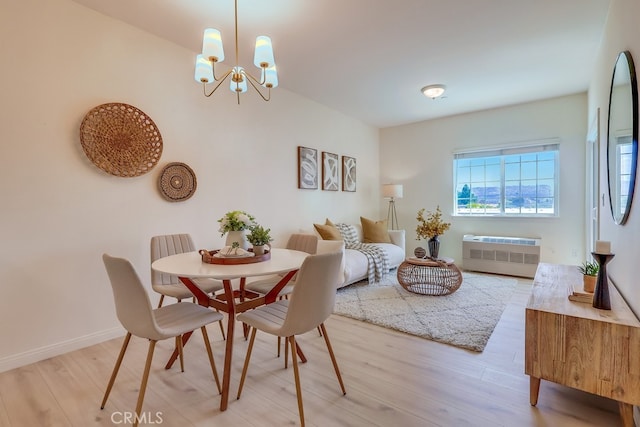 3120 Sepulveda Blvd Unit 312, Torrance, CA 90505 - dining space with light wood-type flooring, a chandelier, and baseboards