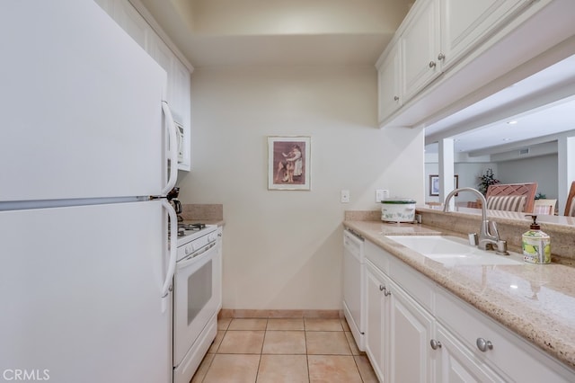 3120 Sepulveda Blvd Unit 312, Torrance, CA 90505 - kitchen featuring white appliances, a sink, light tile patterned floors, white cabinets, and light stone counters