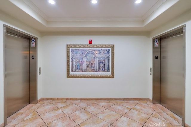 3120 Sepulveda Blvd Unit 312, Torrance, CA 90505 - hall with elevator, a tray ceiling, crown molding, recessed lighting, and light tile patterned floors