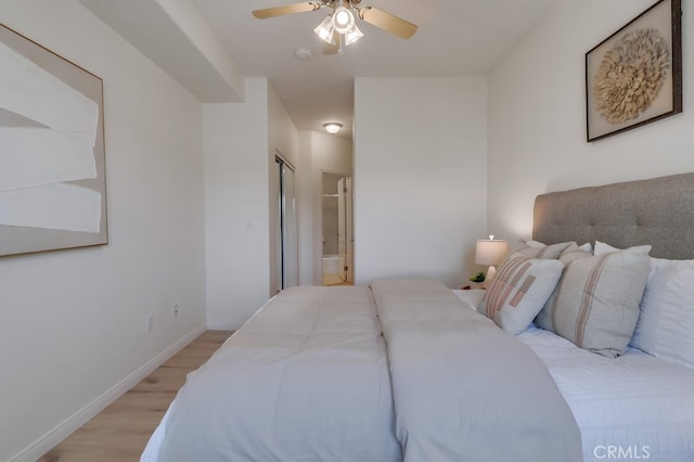 3120 Sepulveda Blvd Unit 312, Torrance, CA 90505 - bedroom with light wood-style flooring, ensuite bathroom, and ceiling fan