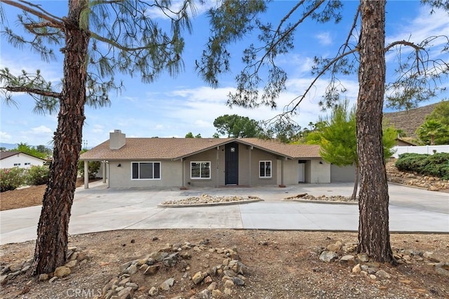 27130 Blue Hill Dr, Menifee, CA 92586 - ranch-style home with concrete driveway, a chimney, and stucco siding