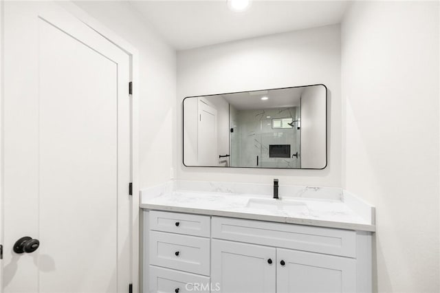 27130 Blue Hill Dr, Menifee, CA 92586 - full bathroom featuring vanity, a marble finish shower, and recessed lighting