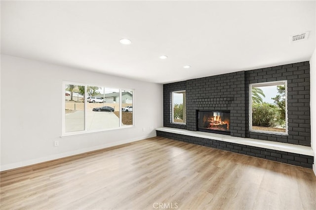 27130 Blue Hill Dr, Menifee, CA 92586 - unfurnished living room with wood finished floors, healthy amount of natural light, baseboards, and recessed lighting